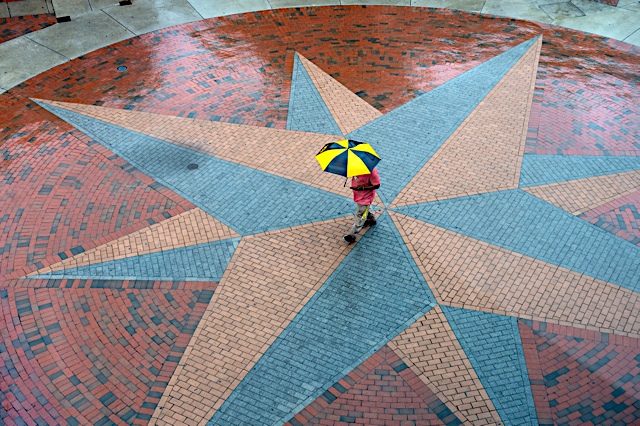 The compass landmark in the rain
