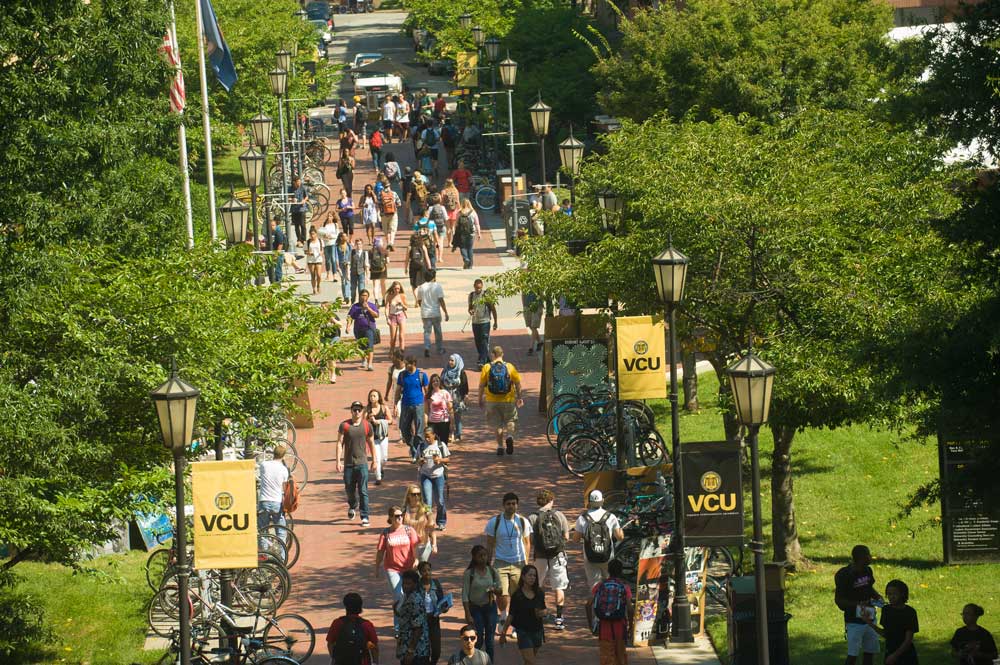 Students walk down a pathway to class